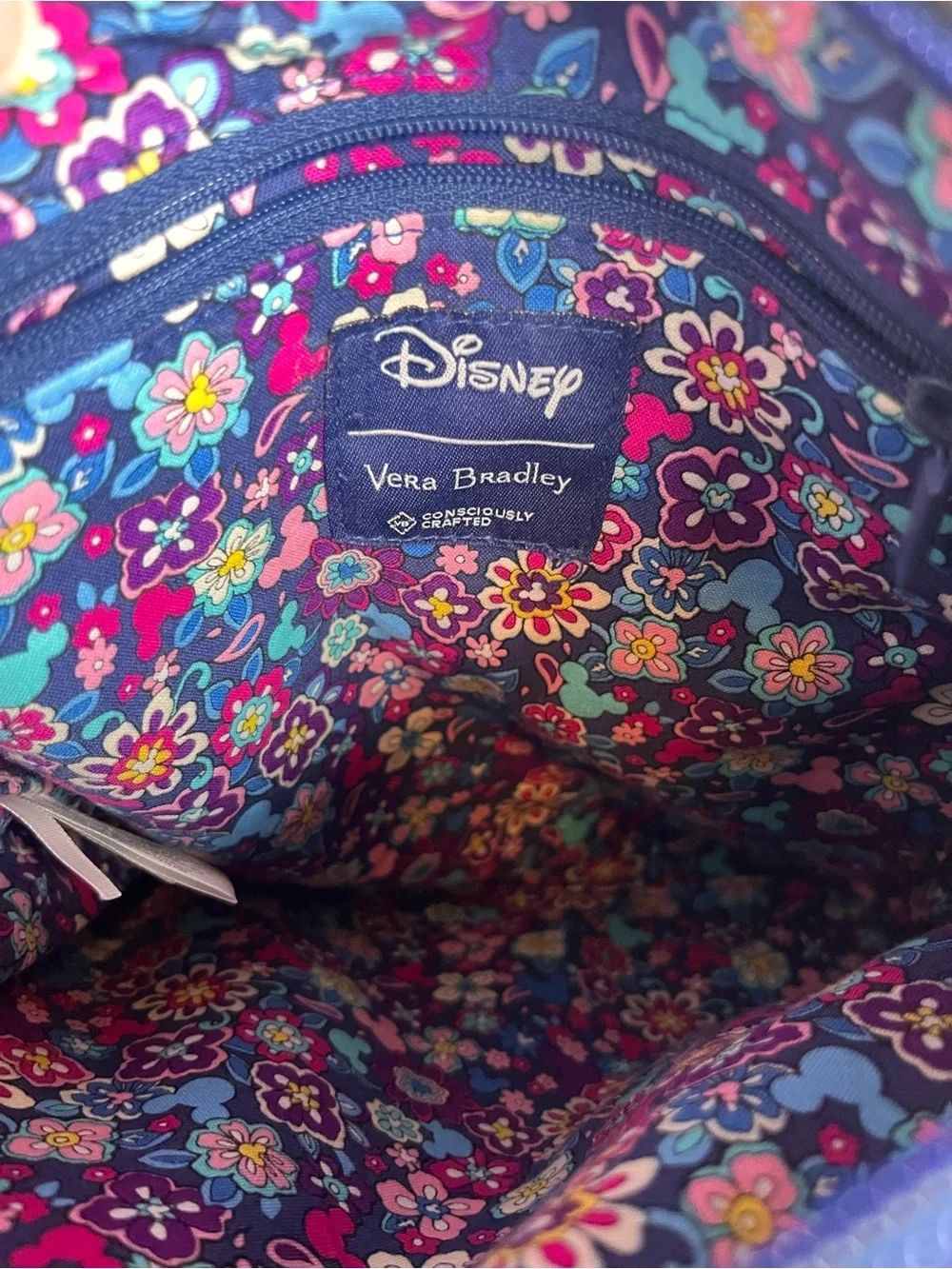 Vera Bradley Disney Collab Triple Zip Hipster in sensational six pattern.